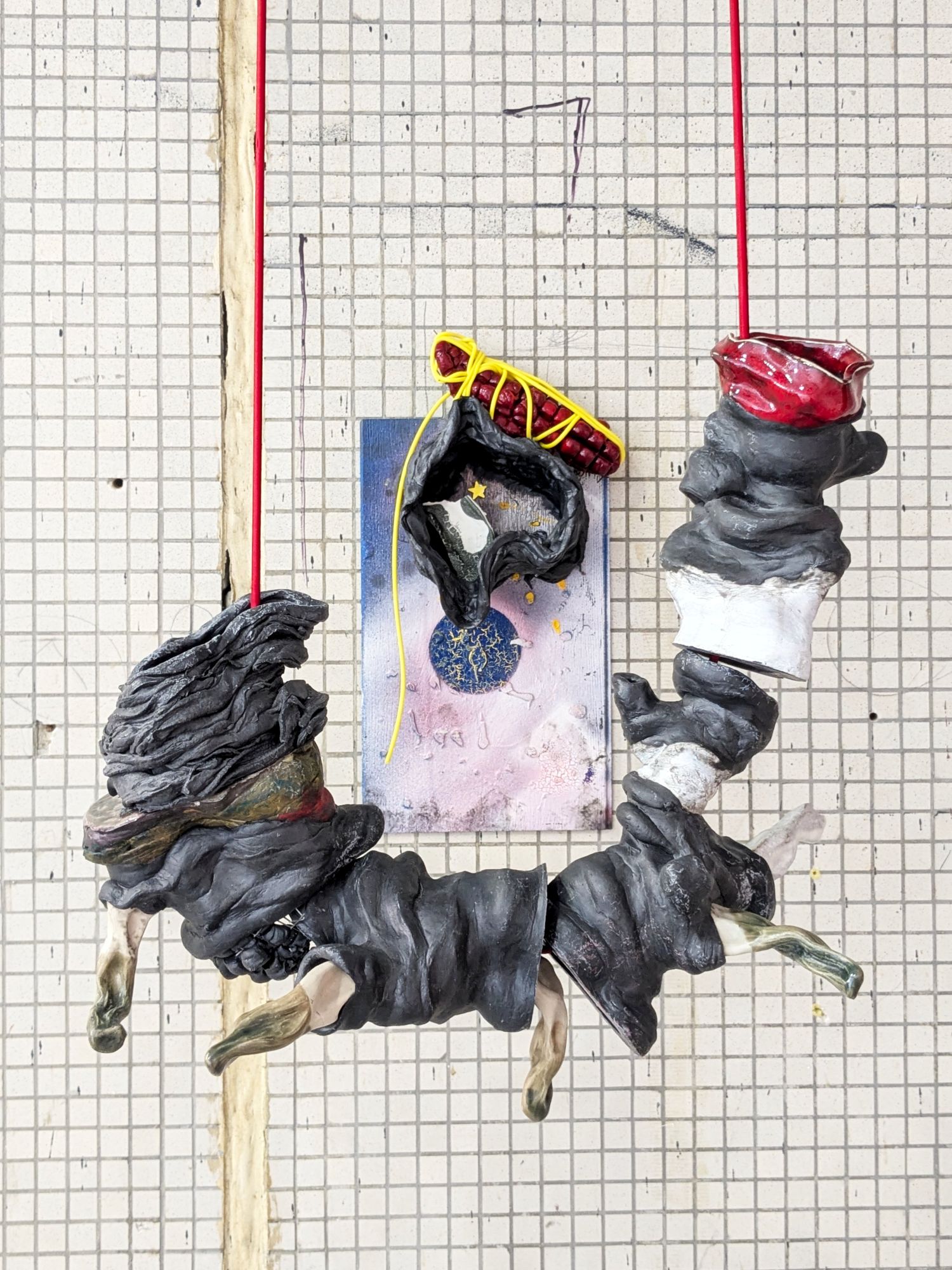 And Endogenidia was his name-o, 2025.
Materials: Epoxy, glazed ceramic, steel, sticker, flooring sample, rubber tube, paint, bungee cord.
