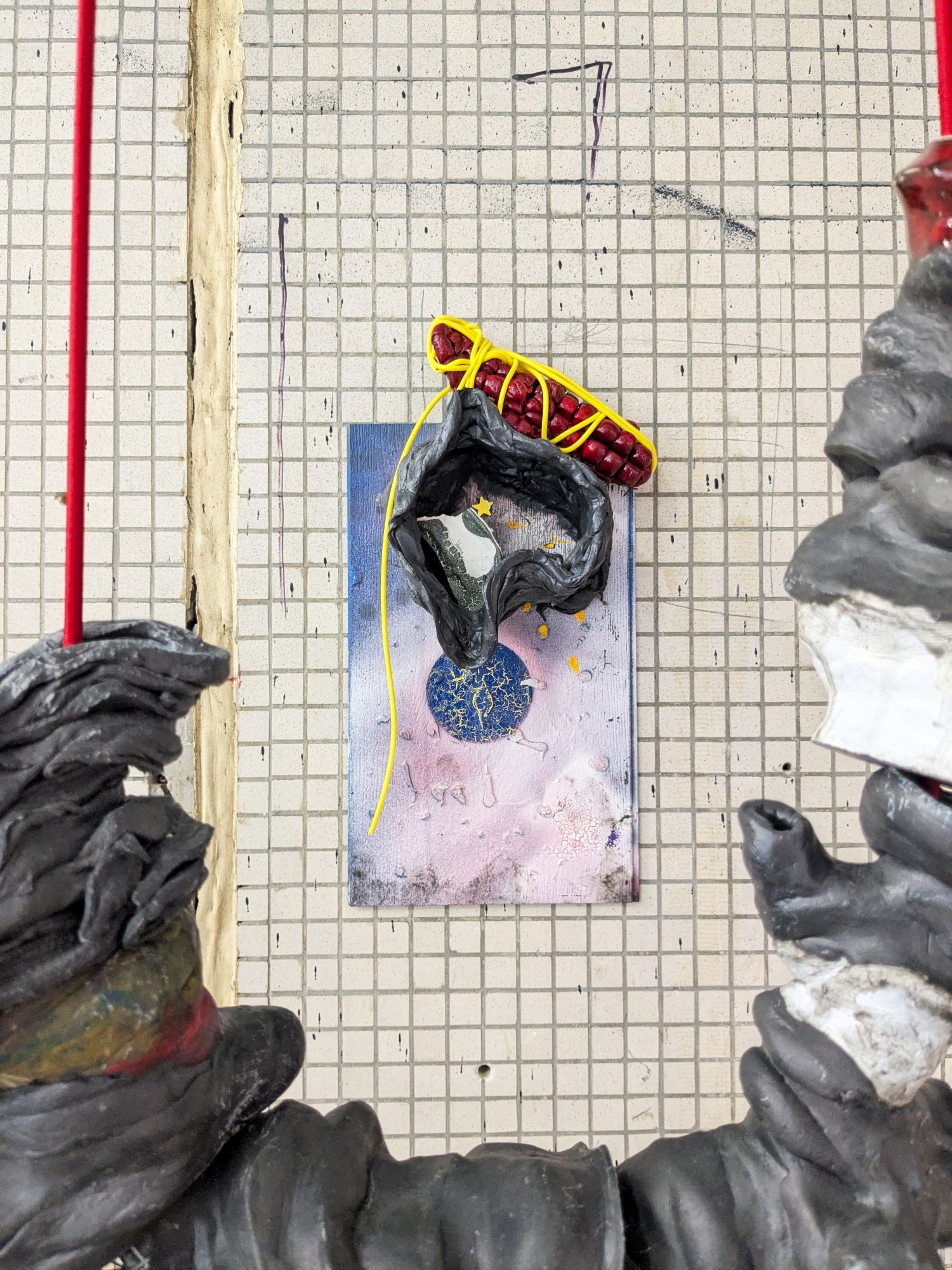 And Endogenidia was his name-o, 2025.
Materials: Epoxy, glazed ceramic, steel, sticker, flooring sample, rubber tube, paint, bungee cord.
