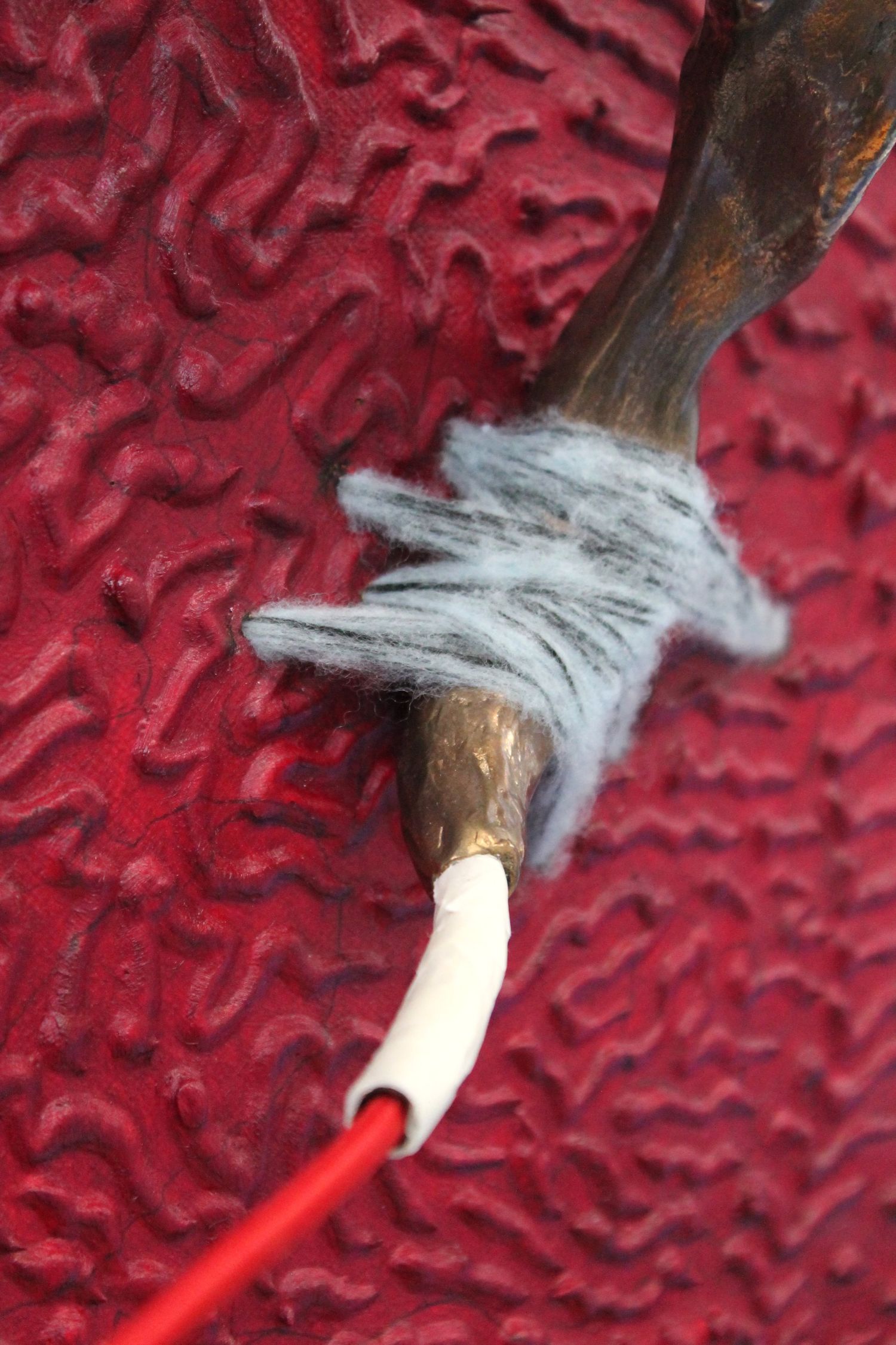 I had plans but I guess this is fine too, 2025. Bronze, masking tape, bungee cord, oil paint, caulk, copper tube, canvas, plywood, timber, wool.